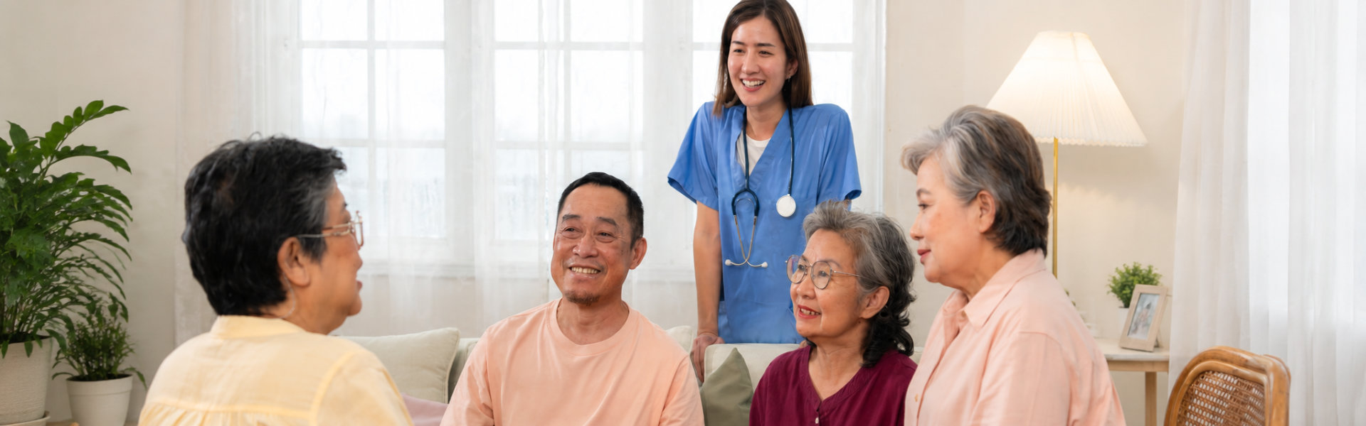senior woman in wheelchair with her caregiver